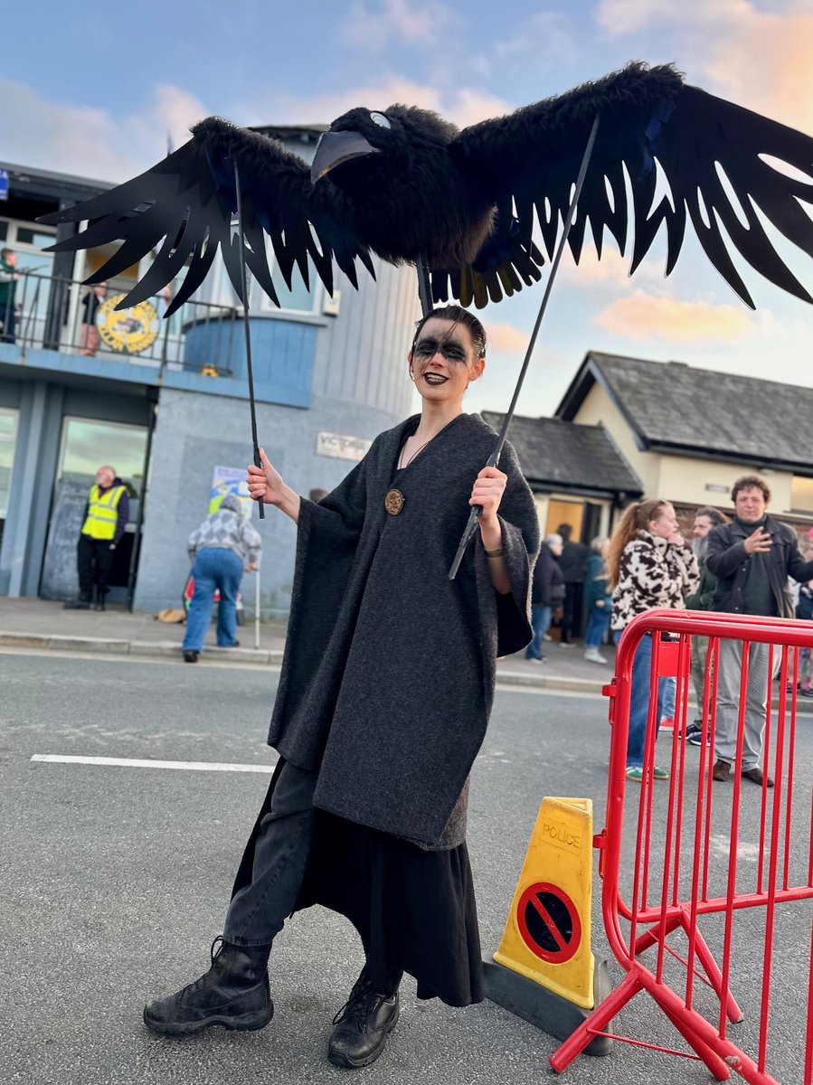 Viking performer with large raven puppet at Peel street festival