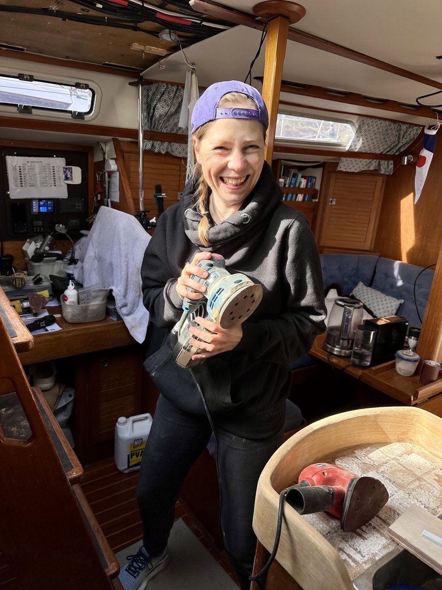Andrea with the orbital sander in the saloon