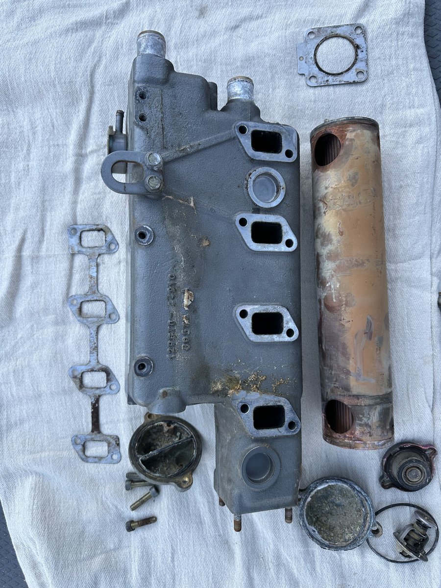 Disassembled engine heat exchanger laid out for inspection