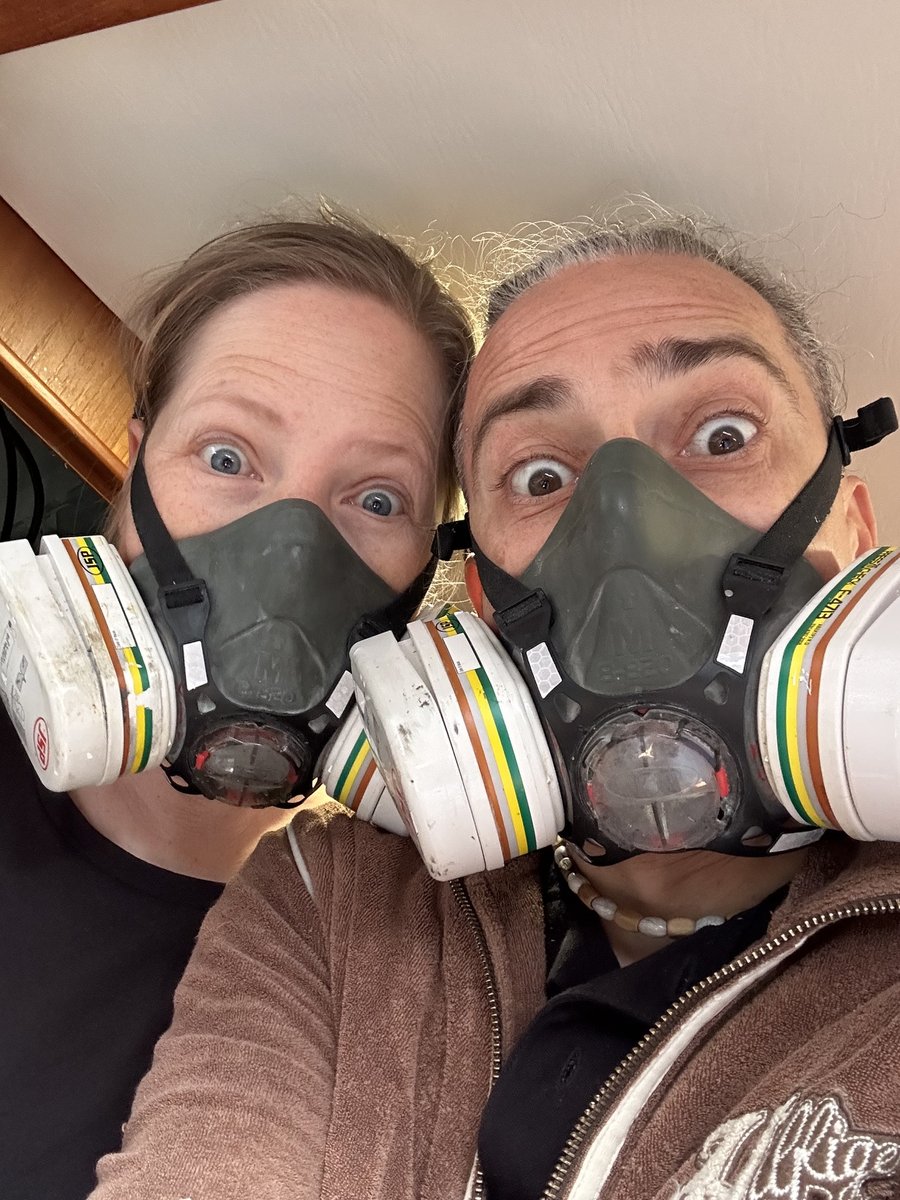 Rob and Andrea in respirator masks during sanding work