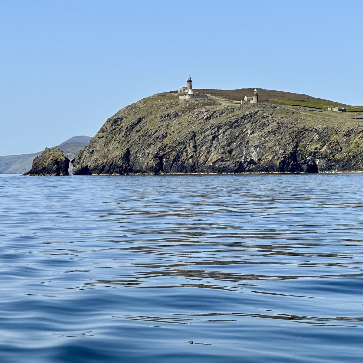 Calf of Man lighthouses - two towers and station buildings on the cliff top