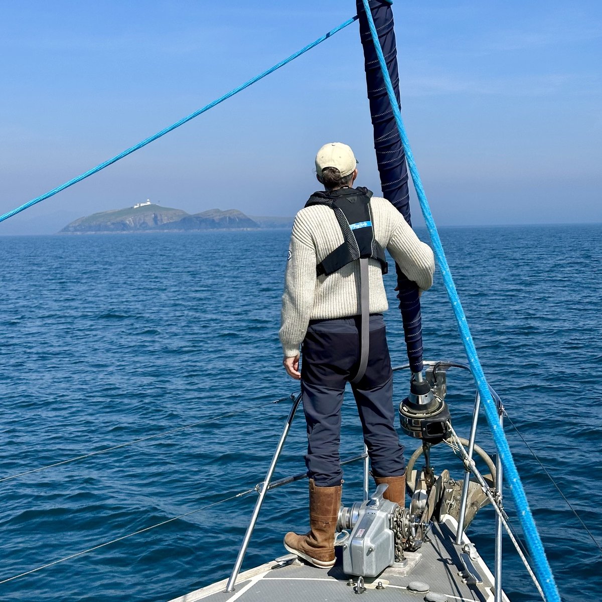 On the bow looking out toward the coastline and lighthouse