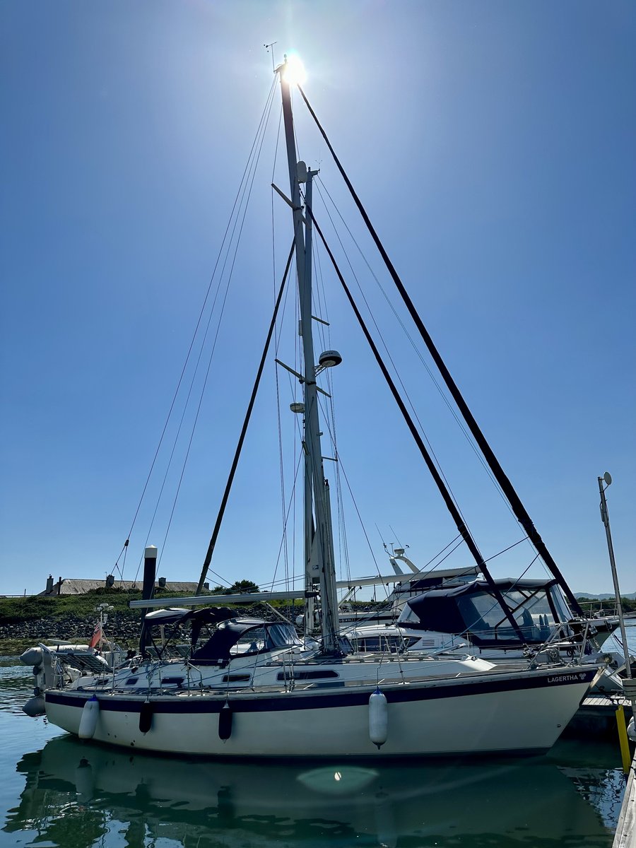 Lagertha at the marina - name on the stern, turquoise water