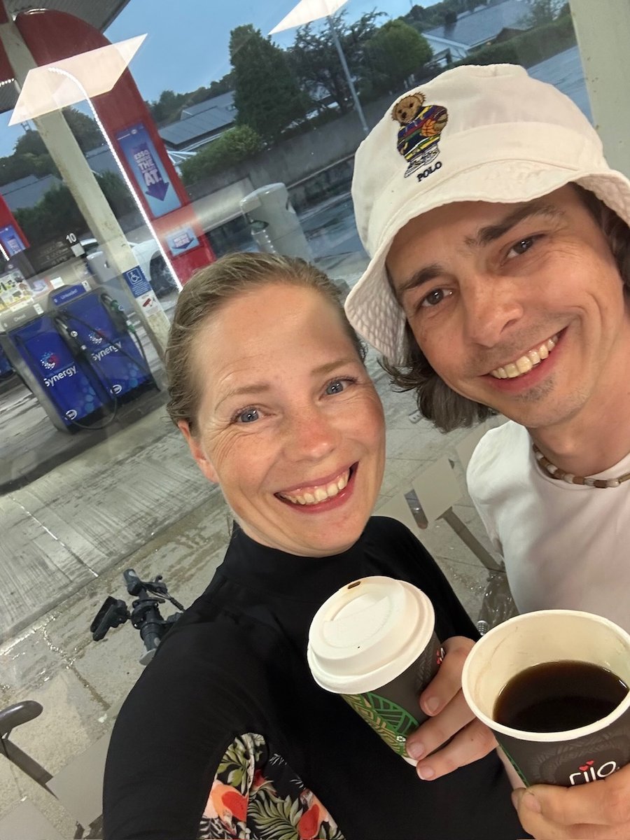 Rob and Andrea with coffee at the petrol station, waiting out the thunderstorm