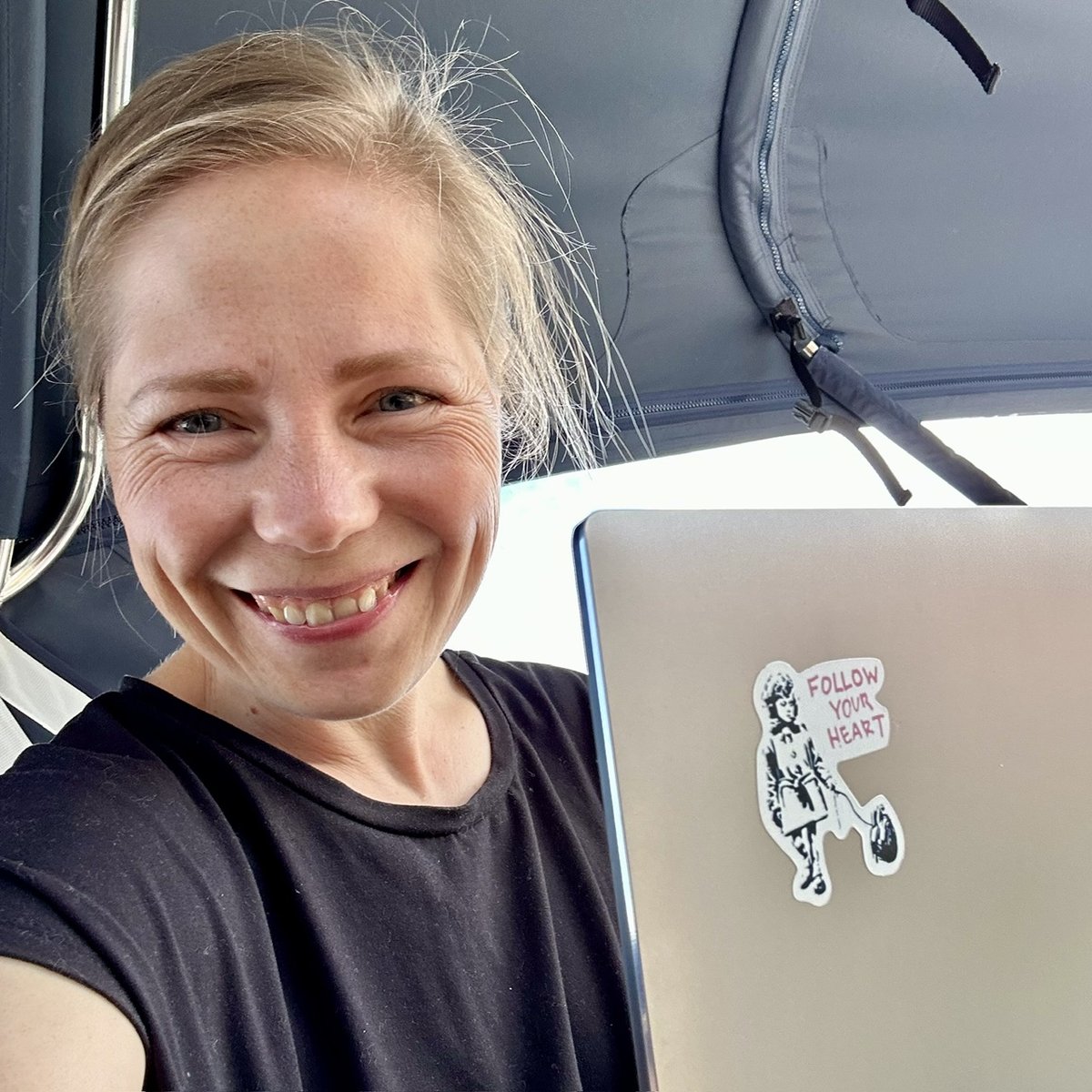 Andrea working on the laptop under the cockpit cover