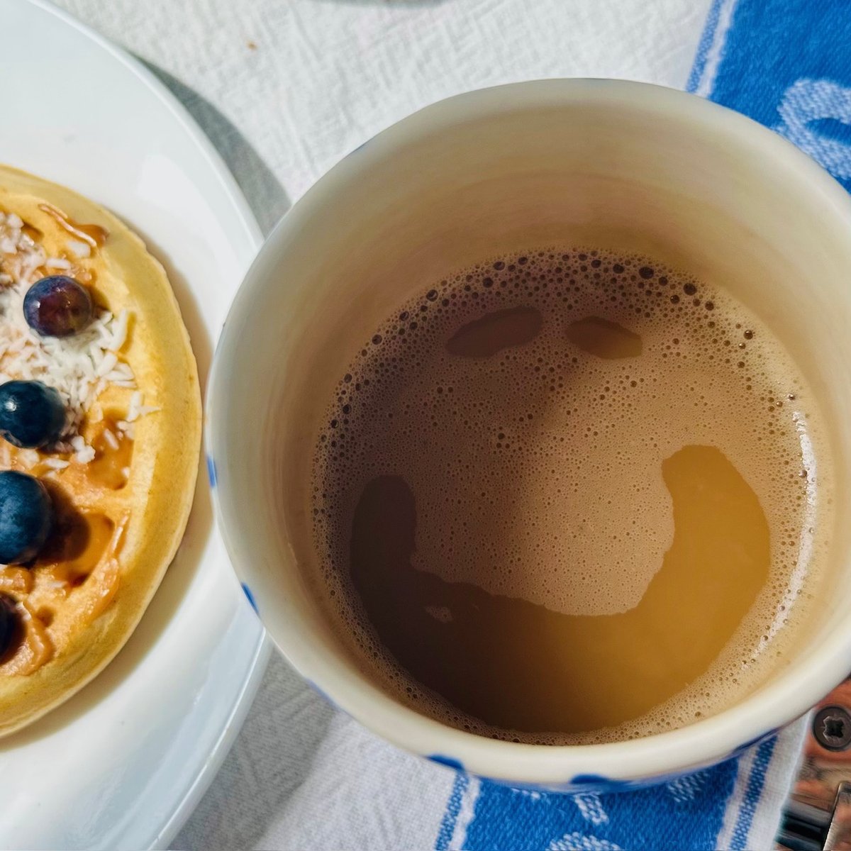 Pancakes with blueberries and coffee - boat breakfast