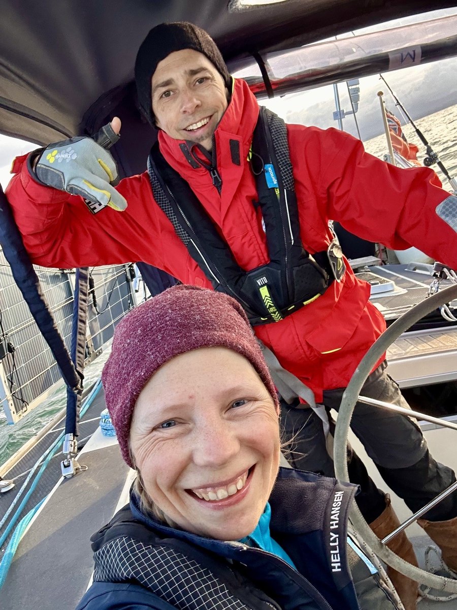 Sailing across Cardigan Bay - Rob and Andrea on deck in the morning light
