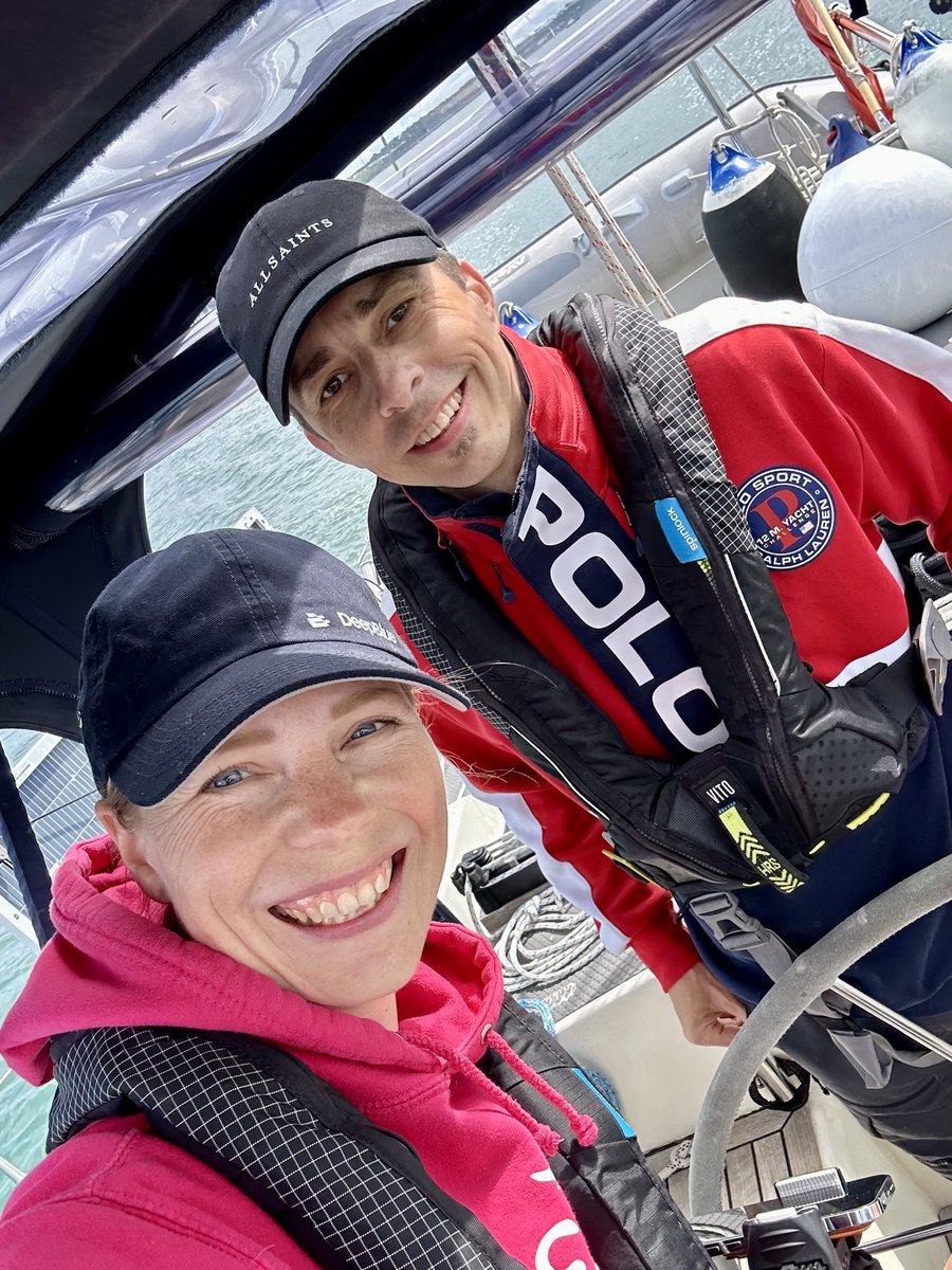 Rob and Andrea on deck in life jackets, bright day on the Bristol Channel