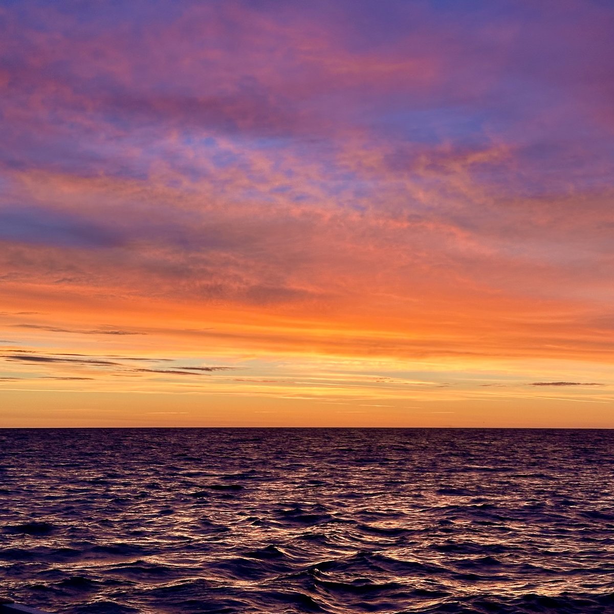 Morning sunrise - dramatic dawn sky in gold, orange, pink and purple