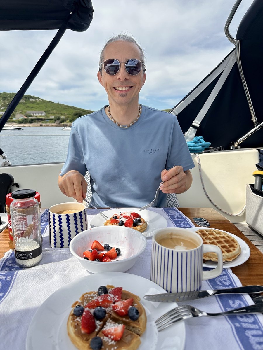 Waffles on arrival - Rob with strawberries, blueberries and coffee at New Grimsby