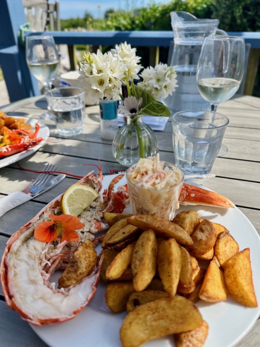 Fresh lobster at Island Fish, Bryher - lobster tail with wedges and white wine