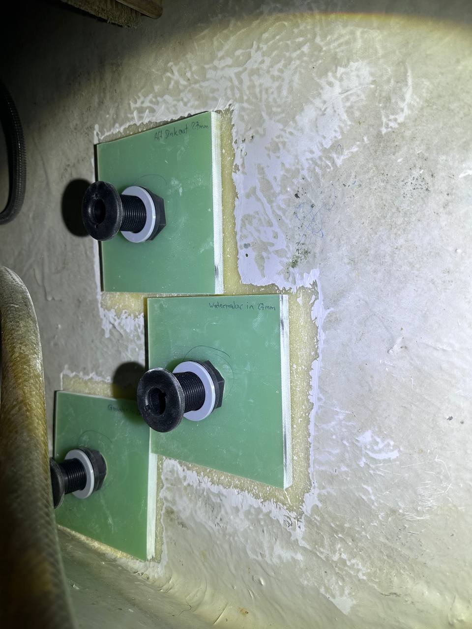 Trudesign through-hulls installed and labelled on composite backing plates