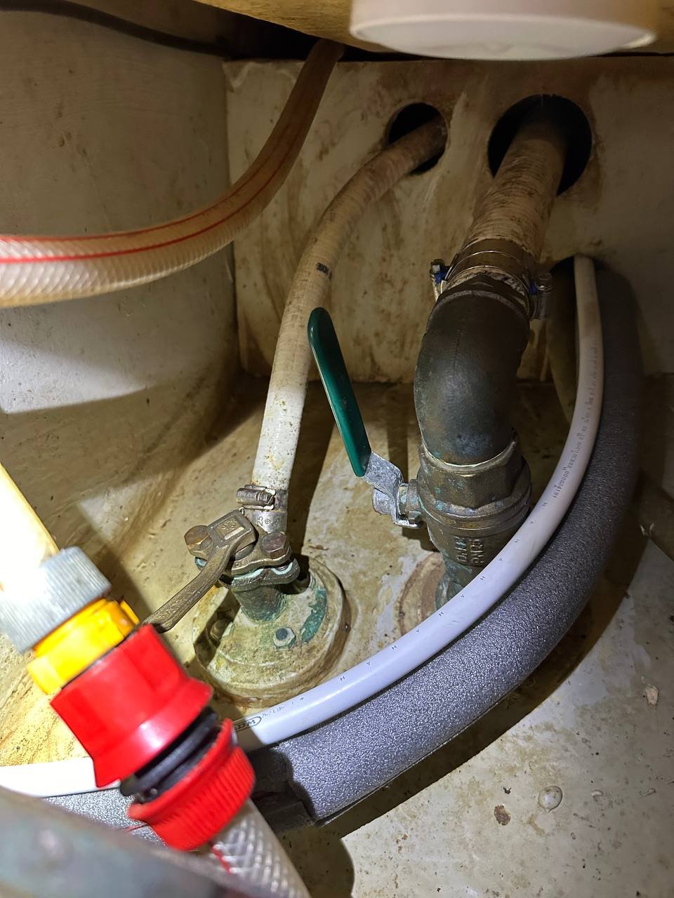 Old marine plumbing - corroded valves, ageing hoses, and cramped access