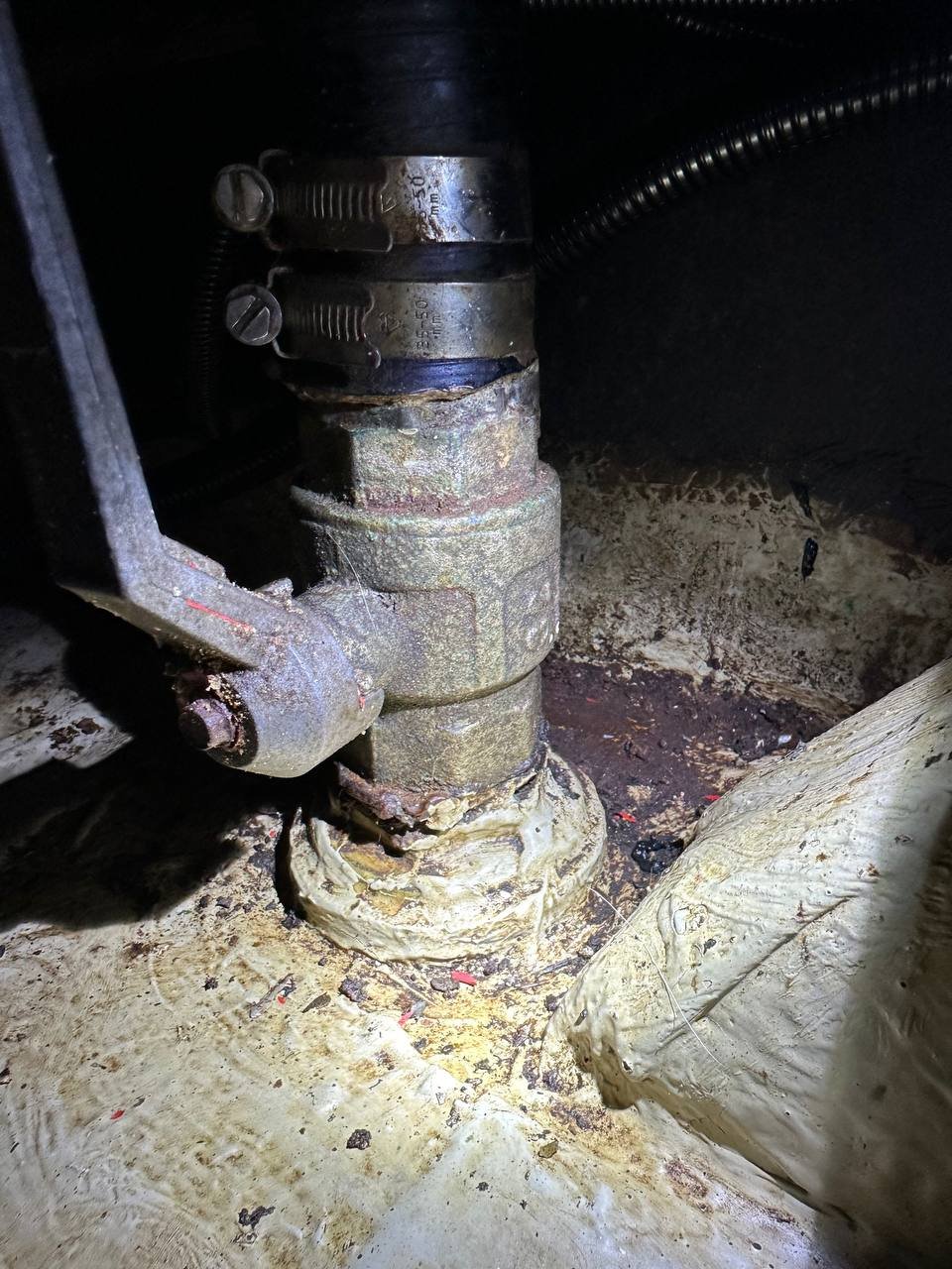 Old ball valve showing dezincification - pink spots indicate zinc leaching from the alloy